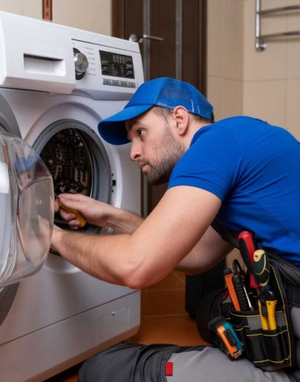 a technician repairing a washer and dryer repair Staten Island